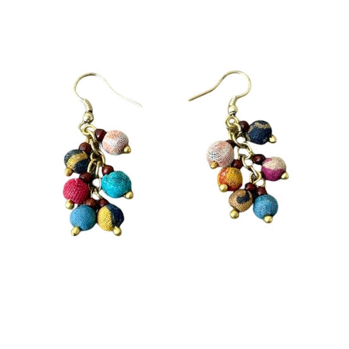 Colorful beaded earrings on a white background