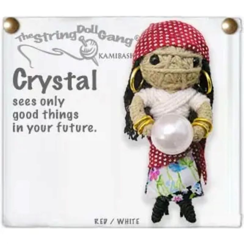 A handmade string doll keychain named 'Crystal' with a crystal ball, dressed in a red and white outfit.