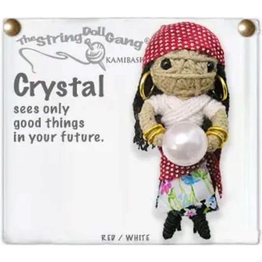 A handmade string doll keychain named 'Crystal' with a crystal ball, dressed in a red and white outfit.