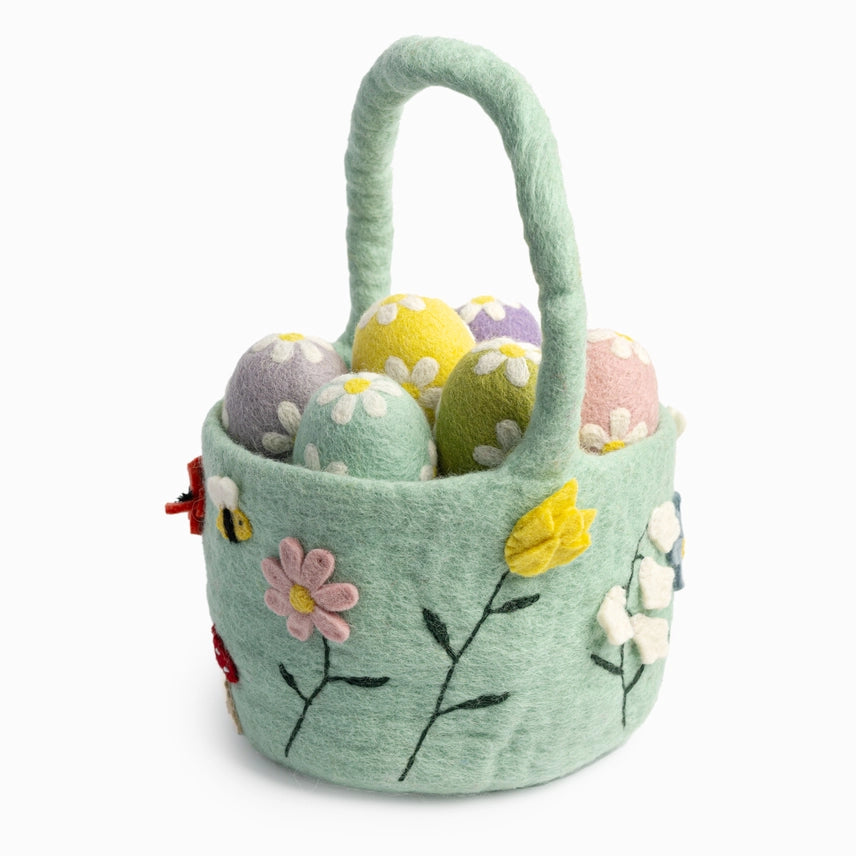 Felt Easter basket with colorful eggs and floral patterns on a white background