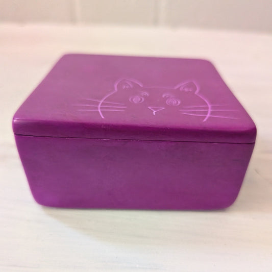 Magenta box with a cat design on a white background