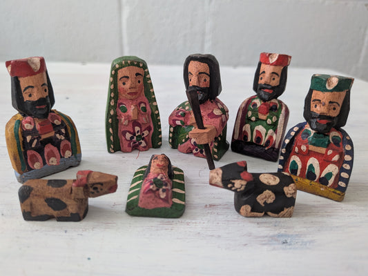 Set of wooden nativity scene figures on a white background