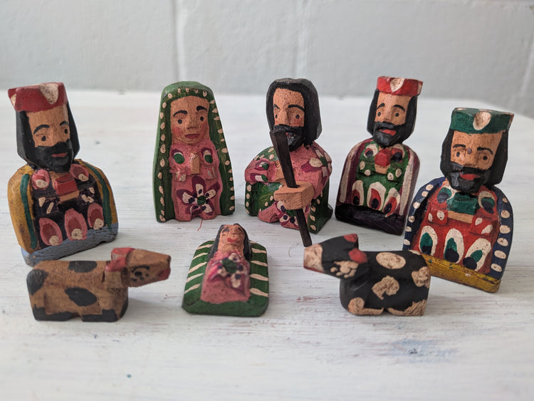 Set of wooden nativity scene figures on a white background