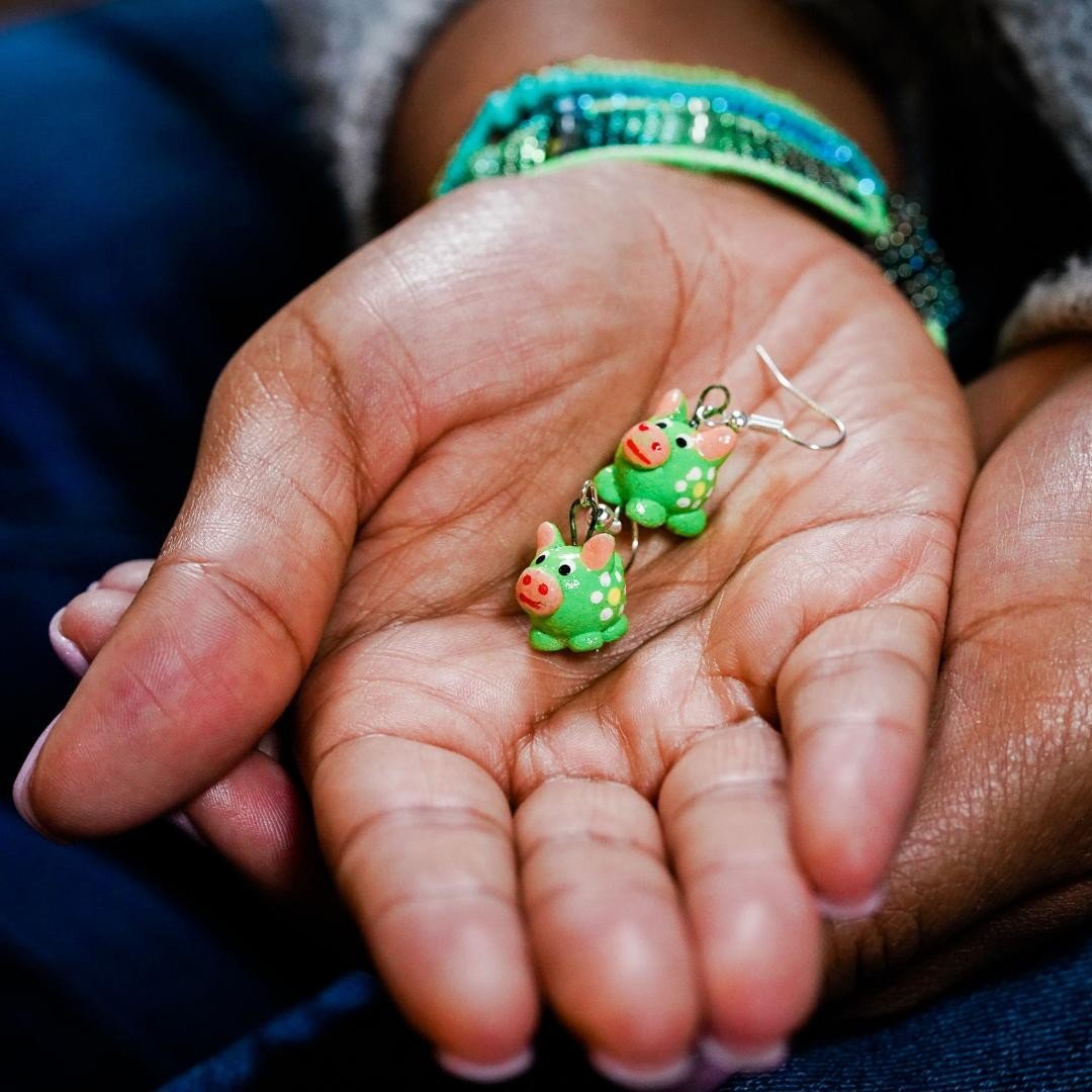 Lucia's World Emporium fair trade and handmade green ceramic pig earrings
