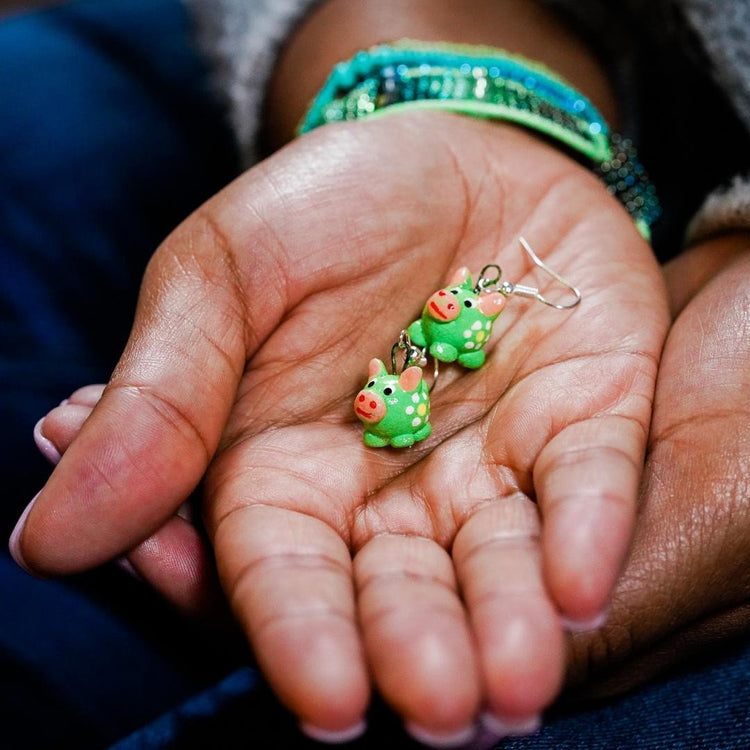 Lucia's World Emporium fair trade and handmade green ceramic pig earrings