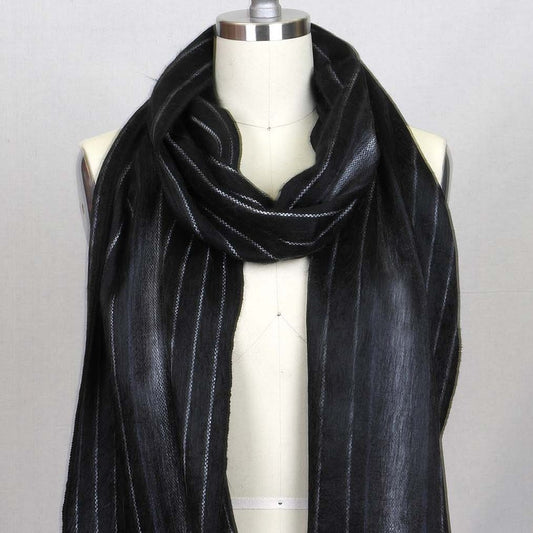 black alpaca fur scarf on mannequin stand