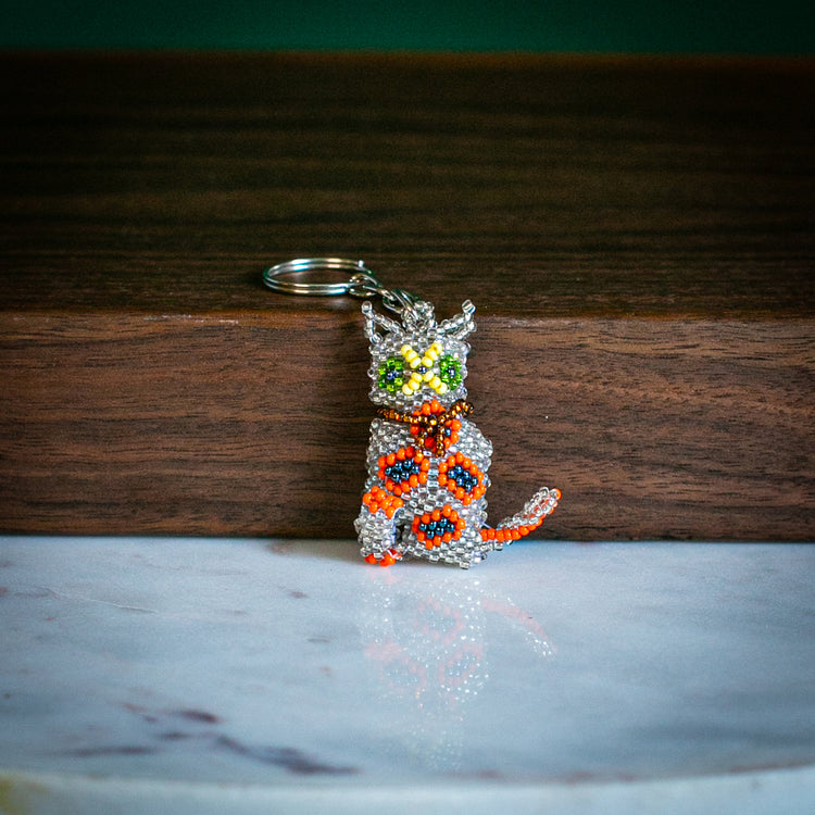 cat keychain on table