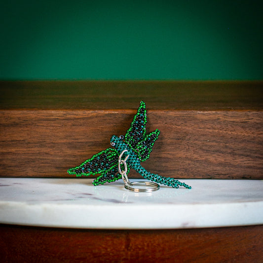 beaded dragonfly keychain on table