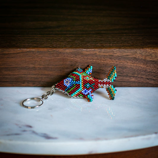 fish keychain on marble table