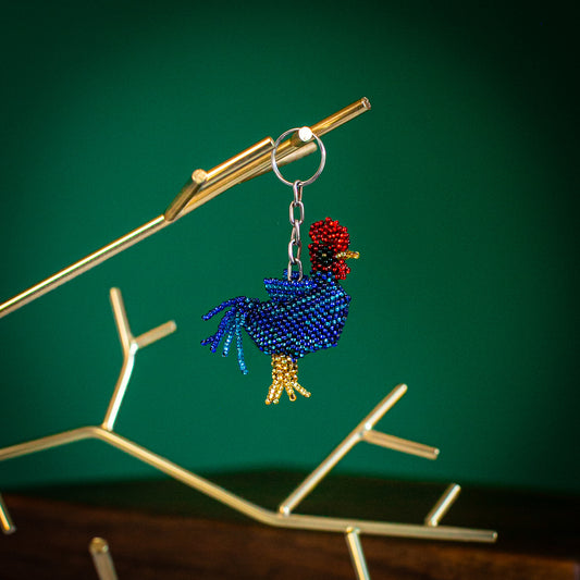 beaded rooster key chain on gold tree stand