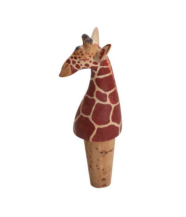 A wooden a cork wine bottle stopper carved and painted to resemble a giraffe
