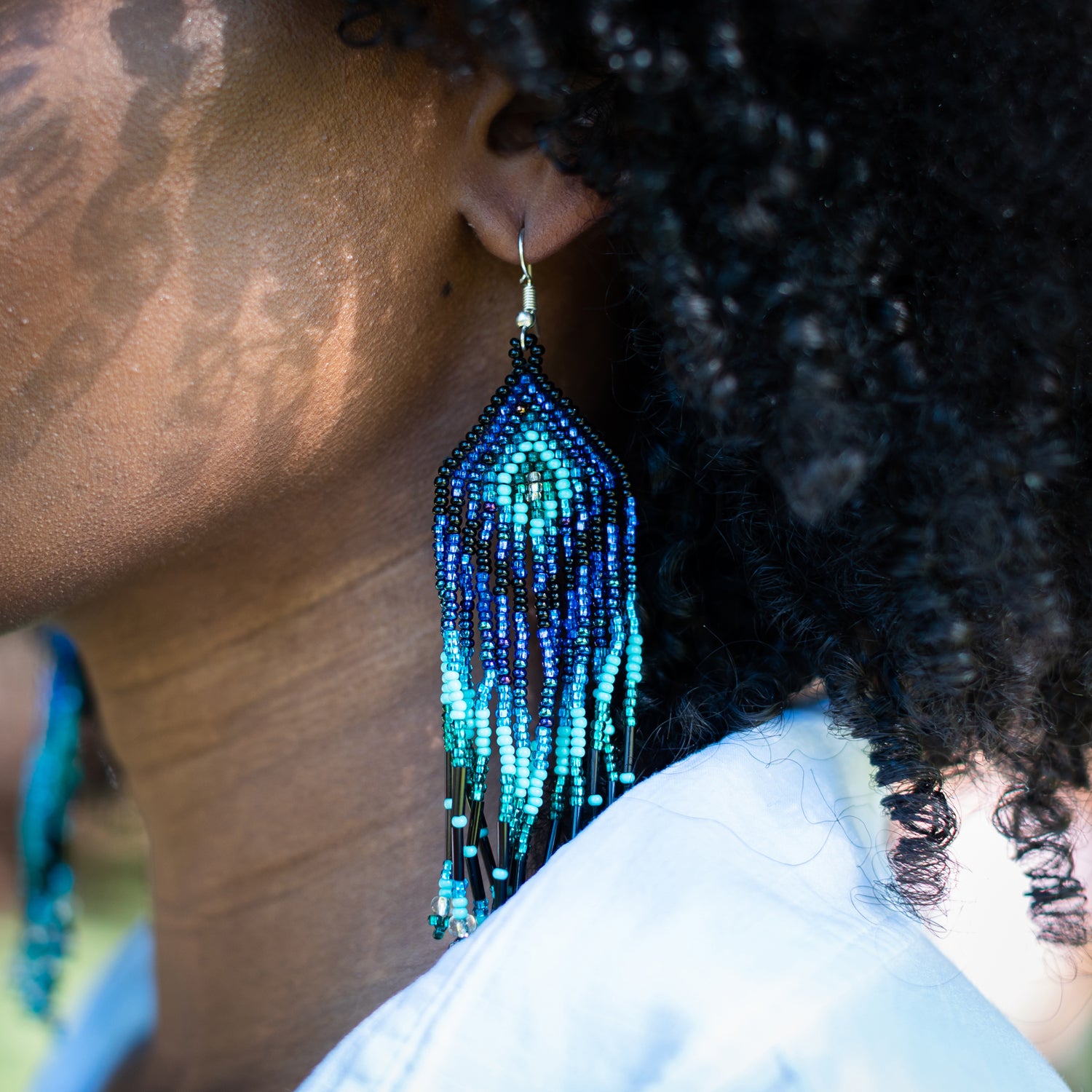 Feather beaded earrings hot sale