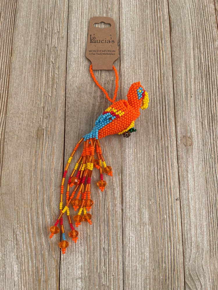 The best selling Hummingbird ornament needed a bird friend! Hand beaded hummingbird comes in an assortment of colors, perfect for your car, window sill, and tree!