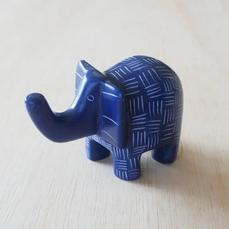 A small blue elephant-shaped soapstone with etched patterns that can be used as a ring holder.