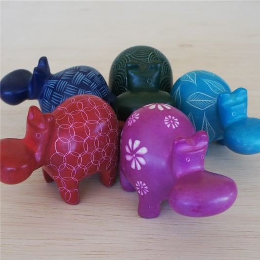 5 hand-carved soapstone elephants of different colors.