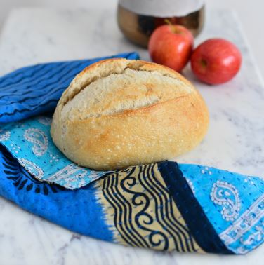 blue kantha dish towel wraps bread loaf